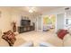 Bright and airy living room with tile floors, comfortable seating, and stylish decor at 3315 S Atlantic Ave # 1106, Daytona Beach, FL 32118