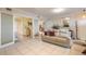 Open-concept living room showing tile floors and view of bedroom and kitchen at 3315 S Atlantic Ave # 1106, Daytona Beach, FL 32118