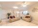 Bright living room featuring stylish sofas, tile flooring, and a welcoming ambiance at 3315 S Atlantic Ave # 1106, Daytona Beach, FL 32118