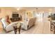 Open-concept living area with tile floors, comfortable seating, and access to another bedroom at 3315 S Atlantic Ave # 1106, Daytona Beach, FL 32118