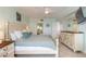 Tranquil bedroom with tiled floors, easy access to the ensuite bathroom, and a beautiful balcony at 3315 S Atlantic Ave # 1106, Daytona Beach, FL 32118