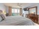 Serene bedroom featuring a balcony overlooking the water, a large dresser, and comfortable seating at 3315 S Atlantic Ave # 1106, Daytona Beach, FL 32118