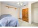Cozy bedroom featuring a bed, wardrobe, and a ceiling fan, offering a comfortable space at 370 Charles Ave, Orange City, FL 32763