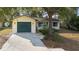 A charming home with a well-manicured lawn, a paved driveway, and a spacious attached garage at 370 Charles Ave, Orange City, FL 32763