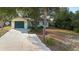 Charming home featuring a well-maintained yard, a paved driveway, and a convenient attached garage at 370 Charles Ave, Orange City, FL 32763
