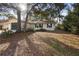 Inviting single-story home featuring a one-car garage, classic shutters, and large trees at 370 Charles Ave, Orange City, FL 32763