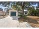 Charming single story home with attached one-car garage, mature trees, and a well-maintained lawn at 370 Charles Ave, Orange City, FL 32763