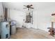 Garage with water heater and ample room for storage with overhead ceiling fan for circulation at 370 Charles Ave, Orange City, FL 32763