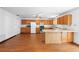 Bright kitchen featuring hardwood floors, modern appliances, and ample counter space at 370 Charles Ave, Orange City, FL 32763