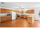 Bright kitchen with wood cabinetry, newer appliances, and an inviting breakfast bar at 370 Charles Ave, Orange City, FL 32763