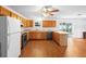 Well-appointed kitchen with wood cabinets, sleek appliances, and ample counter space at 370 Charles Ave, Orange City, FL 32763