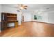Bright living room with wood floors, ceiling fans, and natural light, perfect for entertaining at 370 Charles Ave, Orange City, FL 32763