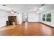 Expansive living room featuring wood floors and multiple ceiling fans for optimal comfort at 370 Charles Ave, Orange City, FL 32763