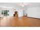 Spacious living room featuring hardwood floors, ceiling fans, and sliding glass doors at 370 Charles Ave, Orange City, FL 32763