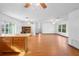 Spacious living area showcasing an open layout and wood flooring throughout at 370 Charles Ave, Orange City, FL 32763