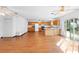 Expansive living area featuring hardwood floors, ceiling fans, and an open kitchen layout at 370 Charles Ave, Orange City, FL 32763
