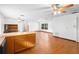 Open-concept layout connecting the living room to the kitchen with beautiful wood floors at 370 Charles Ave, Orange City, FL 32763