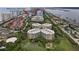 Aerial view of condo and surrounding golf course, pickleball, shopping and medical offices at 4 Oceans West Blvd # 601A, Daytona Beach Shores, FL 32118