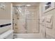 Bathroom showcasing glass enclosed shower with white tiling at 4 Oceans West Blvd # 601A, Daytona Beach Shores, FL 32118