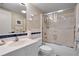 A full bathroom showing the toilet, sink, and shower at 4 Oceans West Blvd # 601A, Daytona Beach Shores, FL 32118