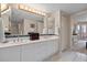 Bright bathroom features a double sink vanity and large mirror at 4 Oceans West Blvd # 601A, Daytona Beach Shores, FL 32118