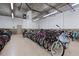 Secured bike storage room with organized racks in a well-lit, climate-controlled building at 4 Oceans West Blvd # 601A, Daytona Beach Shores, FL 32118