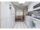 Open-concept eat-in kitchen with a full appliance package and tile flooring at 4 Oceans West Blvd # 601A, Daytona Beach Shores, FL 32118