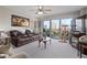 Spacious living room boasts comfortable seating and a sliding door to the balcony at 4 Oceans West Blvd # 601A, Daytona Beach Shores, FL 32118