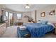 Spacious main bedroom features balcony access and sunny cityscape views at 4 Oceans West Blvd # 601A, Daytona Beach Shores, FL 32118