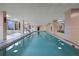 Indoor pool with lots of natural light and a seating area at 4 Oceans West Blvd # 601A, Daytona Beach Shores, FL 32118