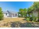 Large backyard with a well-maintained lawn and mature trees at 408 Wisteria Rd, Daytona Beach, FL 32118