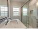 Modern bathroom featuring a glass-enclosed shower and a sleek vanity at 408 Wisteria Rd, Daytona Beach, FL 32118