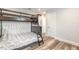 Bedroom featuring a bunk bed and wood-look floors at 408 Wisteria Rd, Daytona Beach, FL 32118