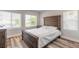Cozy bedroom with natural light, featuring a wooden bed frame at 408 Wisteria Rd, Daytona Beach, FL 32118