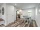 Bright dining area featuring a modern table set and hardwood flooring at 408 Wisteria Rd, Daytona Beach, FL 32118