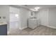 Bright laundry room featuring tile floors and modern washer and dryer at 408 Wisteria Rd, Daytona Beach, FL 32118