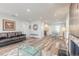Open-concept living area with hardwood floors, seamlessly connected to the dining area at 408 Wisteria Rd, Daytona Beach, FL 32118