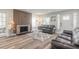 Inviting living room with a brick fireplace and hardwood floors at 408 Wisteria Rd, Daytona Beach, FL 32118