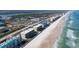 Stunning aerial view of beachfront condos with ocean access and community pool at 4631 S Atlantic S Ave # 8201, Ponce Inlet, FL 32127