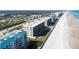 Aerial view of condo buildings near the beach, with community pool and walking access to the ocean at 4631 S Atlantic S Ave # 8201, Ponce Inlet, FL 32127