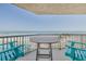 Stunning balcony view overlooking the ocean, complete with outdoor seating for relaxation at 4631 S Atlantic S Ave # 8201, Ponce Inlet, FL 32127