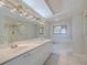 Bright bathroom featuring double vanity, soaking tub, and a separate glass-enclosed shower at 4631 S Atlantic S Ave # 8201, Ponce Inlet, FL 32127