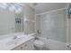 Bathroom featuring a shower-tub combo, sink, and toilet at 4631 S Atlantic S Ave # 8201, Ponce Inlet, FL 32127
