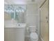 This bathroom features a glass-enclosed shower, vanity, and toilet at 4631 S Atlantic S Ave # 8201, Ponce Inlet, FL 32127