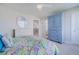 Bright bedroom featuring a large dresser, ceiling fan, and plush carpeting at 4631 S Atlantic S Ave # 8201, Ponce Inlet, FL 32127