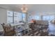 Dining room area with beautiful flooring and ocean views through the windows at 4631 S Atlantic S Ave # 8201, Ponce Inlet, FL 32127