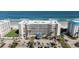 A condo building with well-maintained landscaping, direct beach access, and ample parking for residents and visitors at 4631 S Atlantic S Ave # 8201, Ponce Inlet, FL 32127