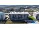 A condo complex featuring manicured lawns, a swimming pool, and a green space for outdoor activities at 4631 S Atlantic S Ave # 8201, Ponce Inlet, FL 32127