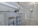 Modern kitchen with white cabinets, stainless steel appliances, and a breakfast bar with seating at 4631 S Atlantic S Ave # 8201, Ponce Inlet, FL 32127