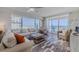 Comfortable living room with ocean views and slider doors to a balcony at 4631 S Atlantic S Ave # 8201, Ponce Inlet, FL 32127